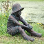 Statue The boy in wellies