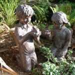 Boy with frog statue