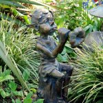 Pixie playing a flute Statue