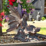 fairy kneeling statue