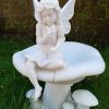 A young Fairy sits atop a toadstool.