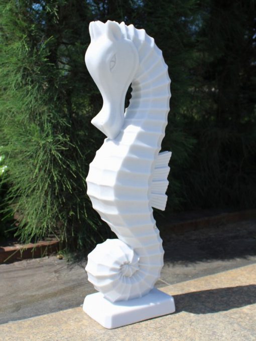 Marble effect statue of a seahorse.