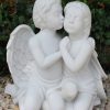 Statue of two cherubs with a marble finish.