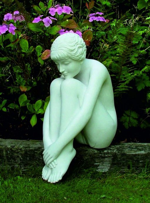 Statue of a young woman with a marble finish.