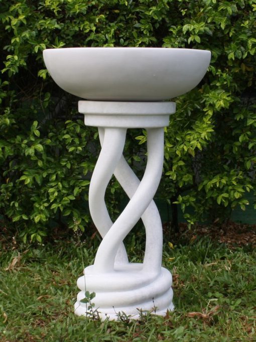 Ornate bird bath with a marble finish.