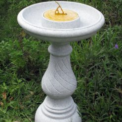 Sundial bird bath with a granite finish.