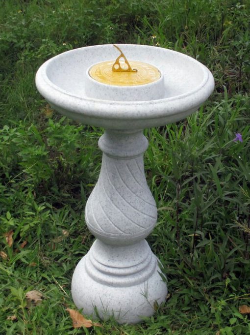 Sundial bird bath with a granite finish.