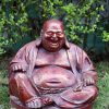 Red statue of the Laughing Buddha.