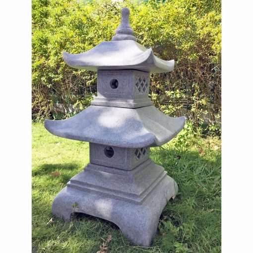 A granite, two tier pagoda garden ornament.